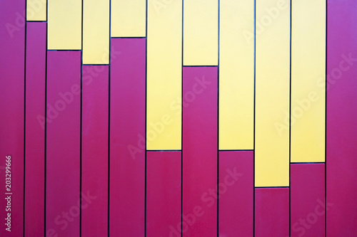 Colorful pink and yellow vertical stripe lines as a background