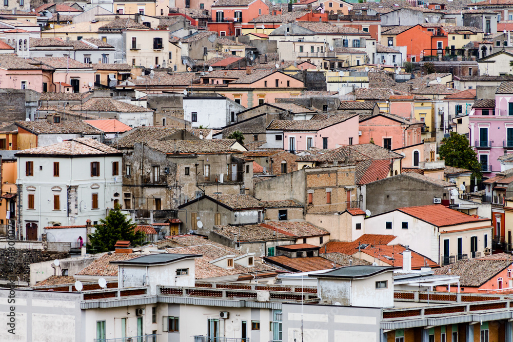 roofs of houses in a densely populated area, urban slums, a densely populated city, houses from a height against the sky