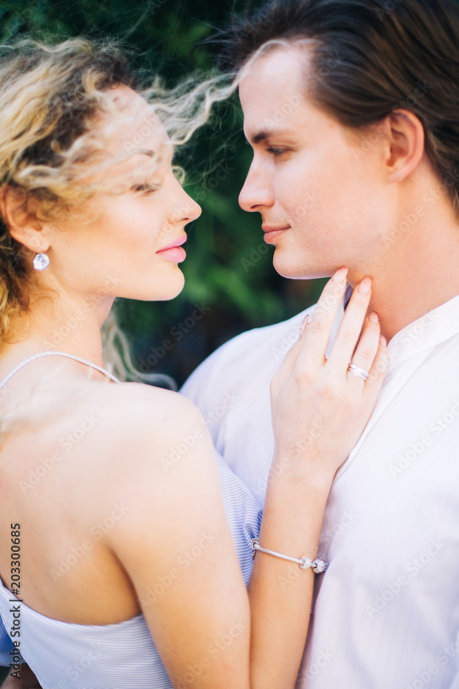Stylish couple in love portrait, Newlywed husband and wife hugging near tree outdoors, summer nature concept, romantic couple on honeymoon resort in hipster dress and shirt Stylish couple in love portrait, Newlywed husband and wife hugging near tree outdoors, summer nature concept, romantic couple on honeymoon resort in hipster dress and shirt