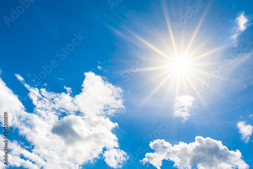 Sunny background  blue sky with white clouds and sun