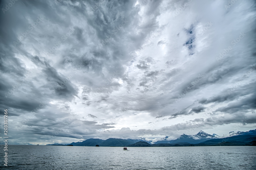 abstract cloudy waterscape AND MOUNTAIN RANGE IN ALASKA abstract cloudy waterscape AND MOUNTAIN RANGE IN ALASKA