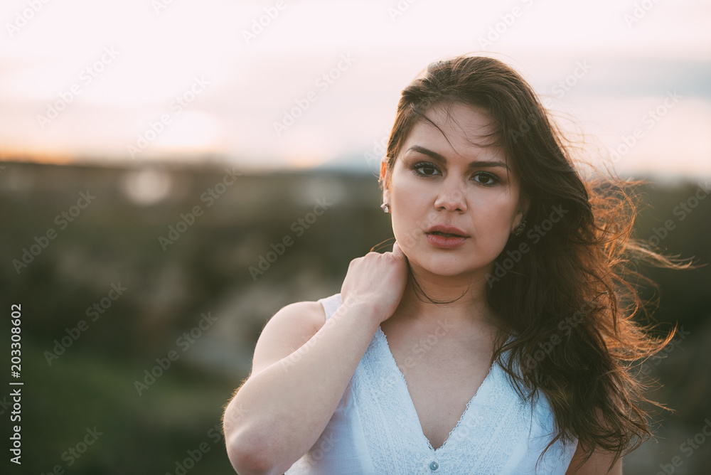 Thoughtful young woman posing on a bridge Thoughtful young woman posing on a bridge