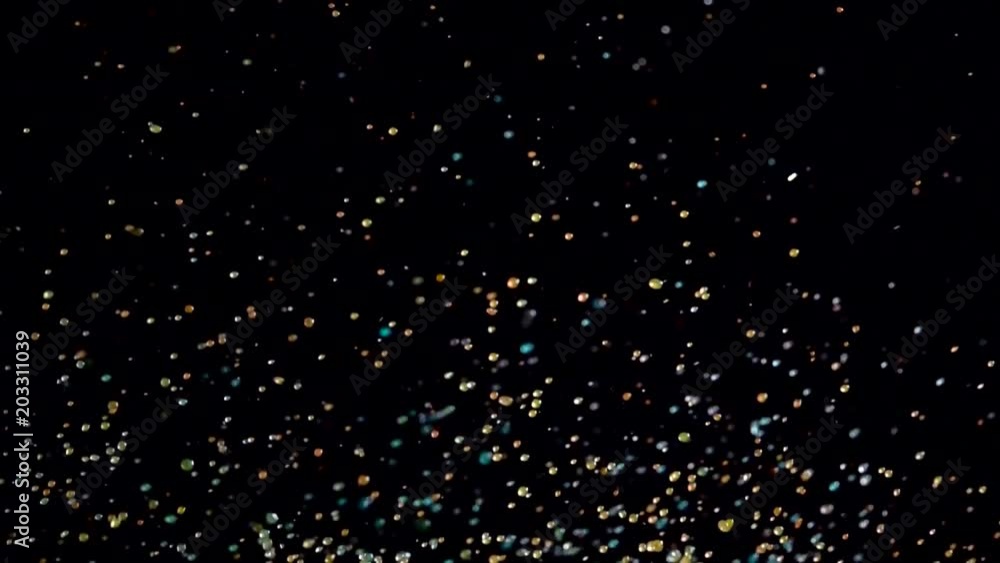 Explosive fountain of color watery balls. Black background. Slow motion Explosive fountain of color watery balls. Black background. Slow motion