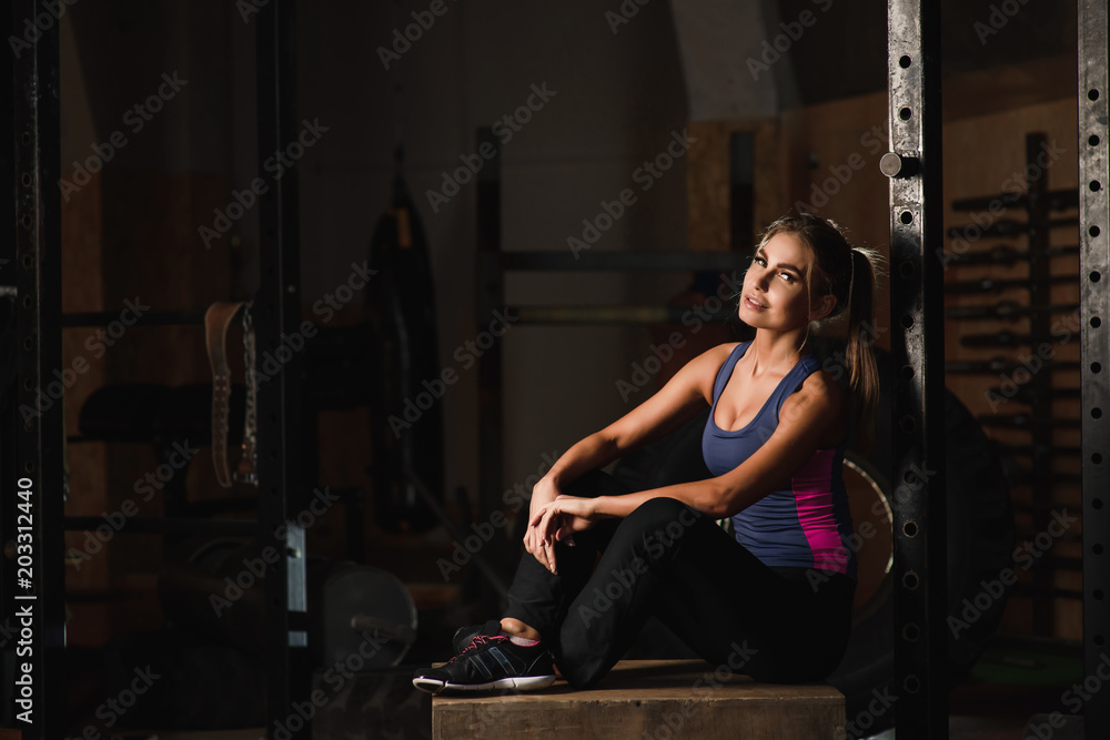 Sporty girl posing in a sports hall Sporty girl posing in a sports hall