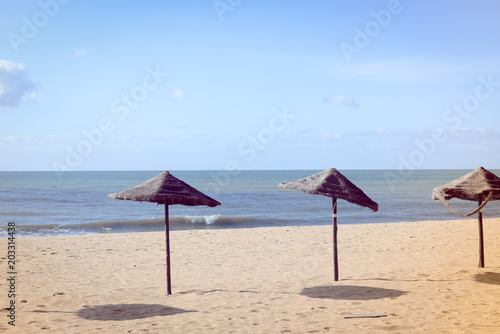 Beach Umbrella - tropical holiday tranquility background. Sunny outdoors seascape