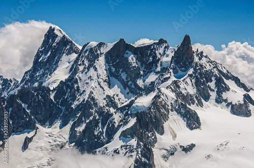 Close-up of snowy peaks and mountains, viewed from the Aiguille du Midi, near Chamonix. A famous ski resort located in Haute-Savoie Province, at the foot of Mont Blanc in the French Alps.