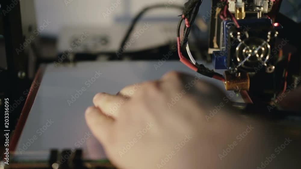 Male hands take a badge printed on 3D printer. Full HD Male hands take a badge printed on 3D printer. Full HD