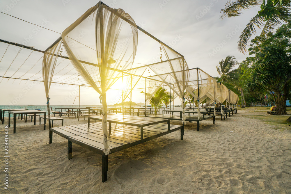 Fototapeta premium Beach bed with sunrise flare in morning time.
