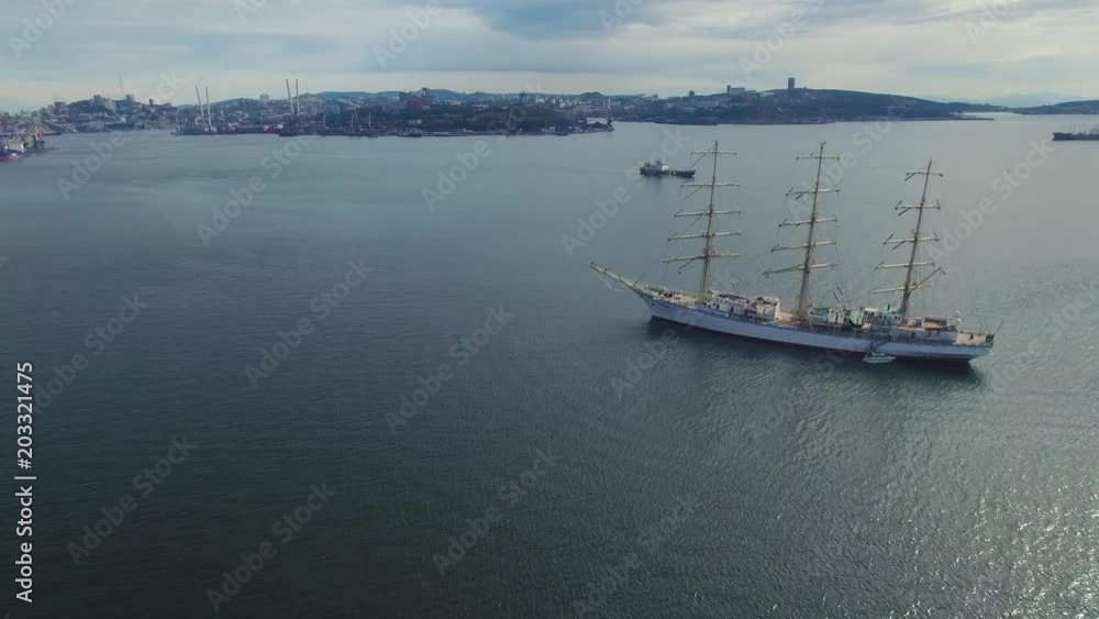 Sailboat in a bay against a background of the city. Sailboat in a bay against a background of the city.