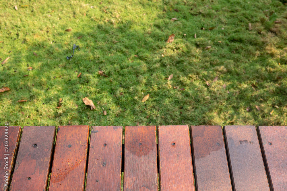 Empty wooden with garden in the background. Can put objects in the picture.