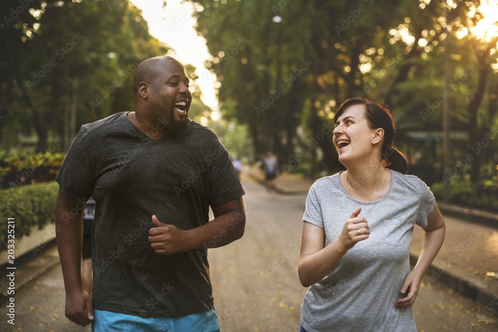 Man and woman running in park Man and woman running in park