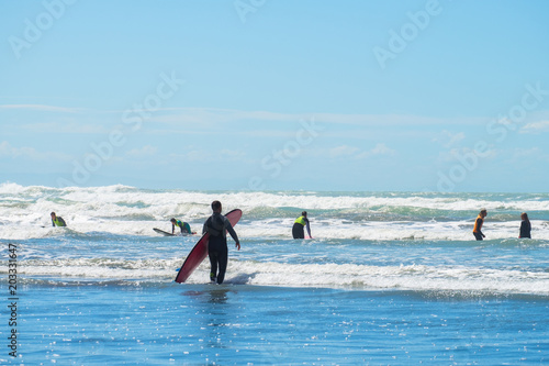 2018, FEB 4 -  Christchurch, New Zealand, People enjoy their activities at the beautiful beach on a sunny blue sky day. Sumner Beach, Christchurch,