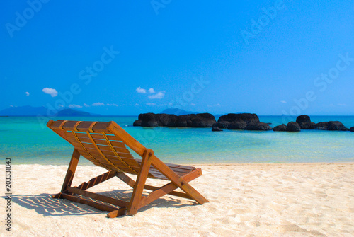 beach chair on the beautiful beach sand and blue sky