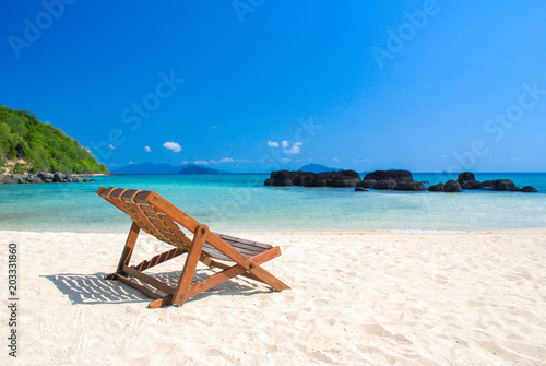 beautiful beach and chair with blue sky © kwanchaift