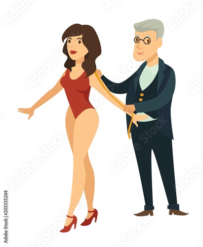 Experienced designer in suit makes measurements of models figure
