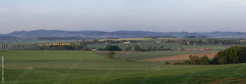 Panoramtic view to Czech landscape with train