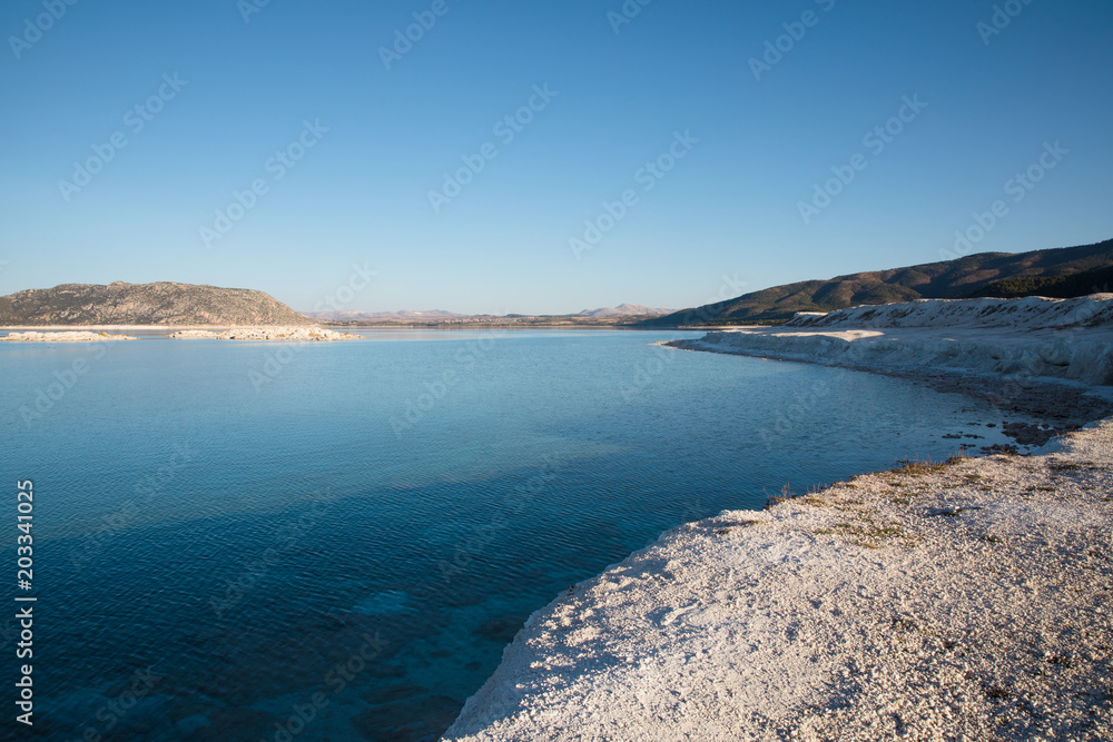 white limestone on shore of beautiful calm lake, salda golu, turkey white limestone on shore of beautiful calm lake, salda golu, turkey
