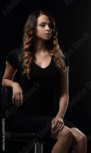 young gorgeous caucasian brunette in dress on chair © ASDF