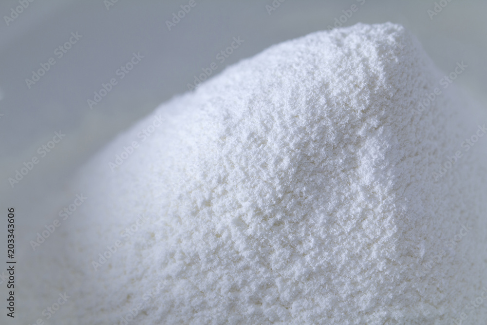 Closeup of a pile of white all-purpose wheat flour isolated with copy space Closeup of a pile of white all-purpose wheat flour isolated with copy space