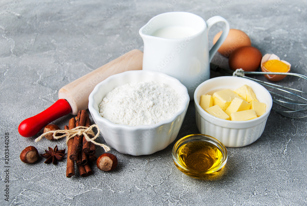 Kitchen table with baking ingredients Kitchen table with baking ingredients