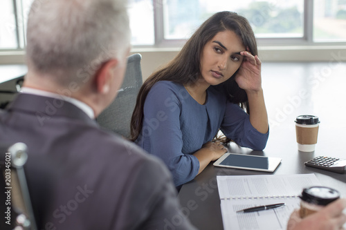 Slika na platnu Business leader instructing focused Indian female assistant