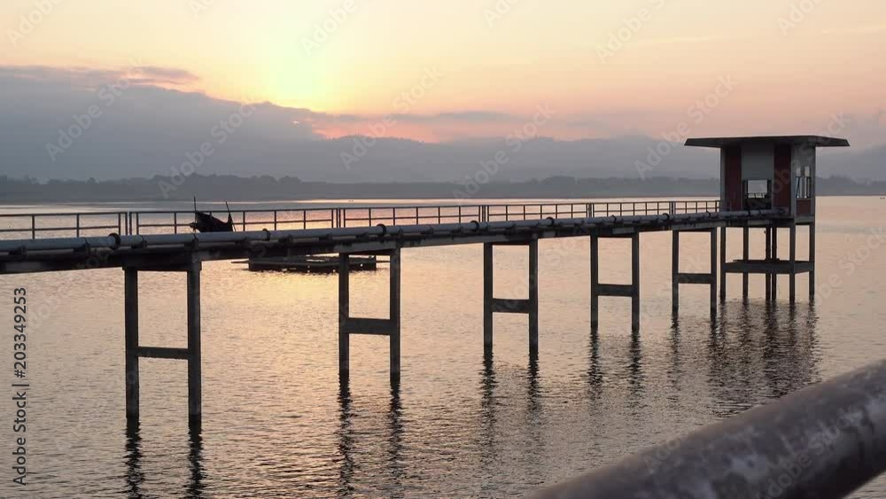 Dolly shot of Landscape view of Bang Phra Reservoir with old pumping station at sunrise. Dolly shot of Landscape view of Bang Phra Reservoir with old pumping station at sunrise.