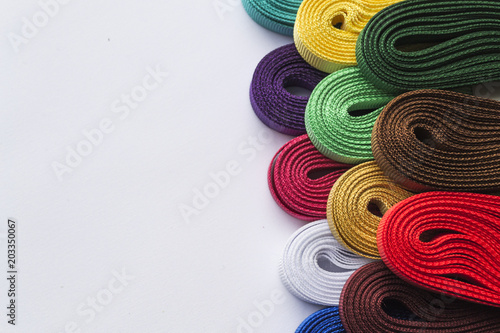 Various colored ribbons on white background. Closeup photo