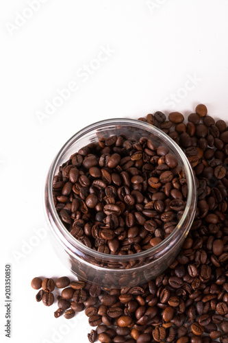 Coffee cup and beans on old kitchen table. Top view with copyspa