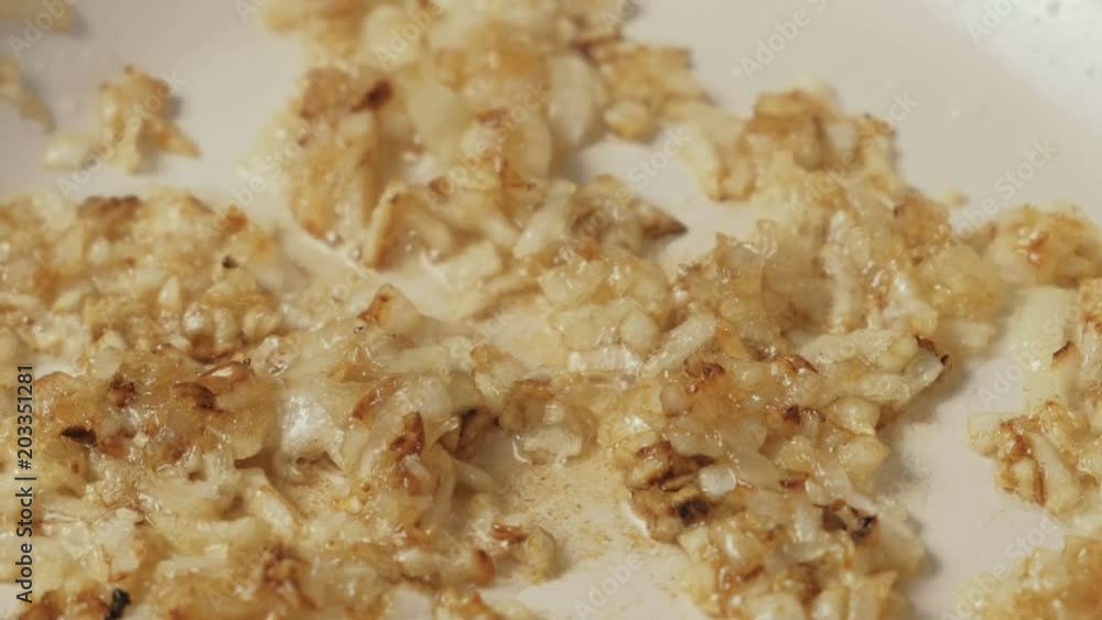 Close-up of onions fried in a pan until Golden brown Close-up of onions fried in a pan until Golden brown