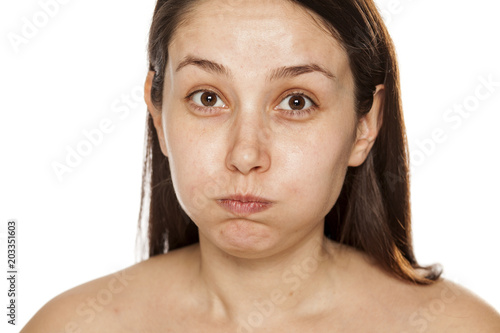 Morning exercise for the facial skin on white background