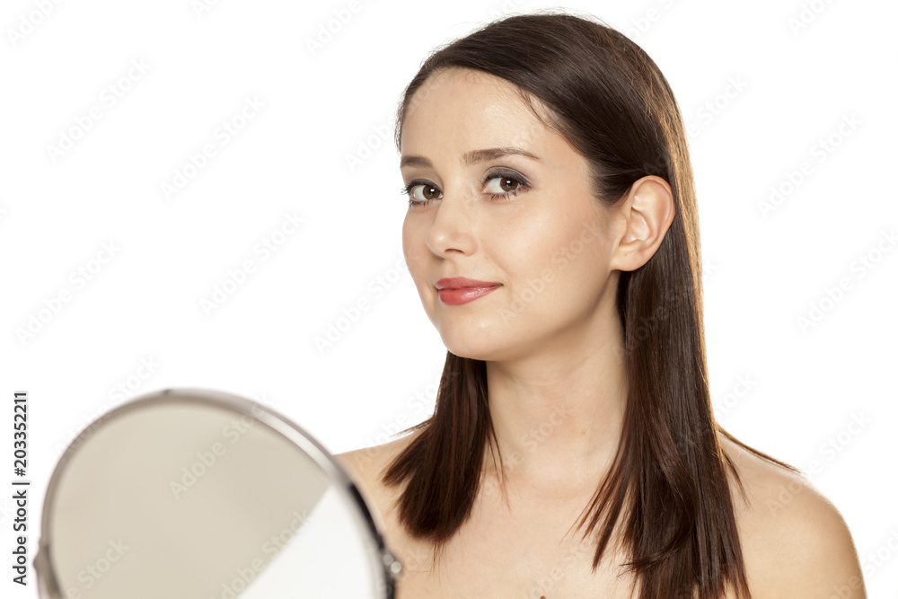 Portrait of young smiling woman with makeup on white background Portrait of young smiling woman with makeup on white background