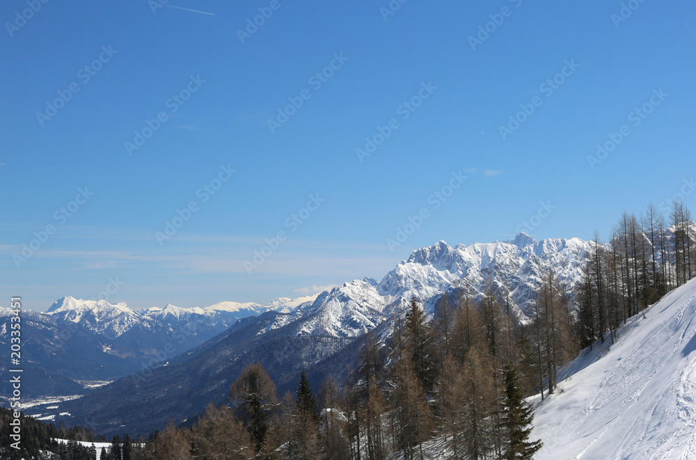 wide panormaric view of moutains with white snow in winter from