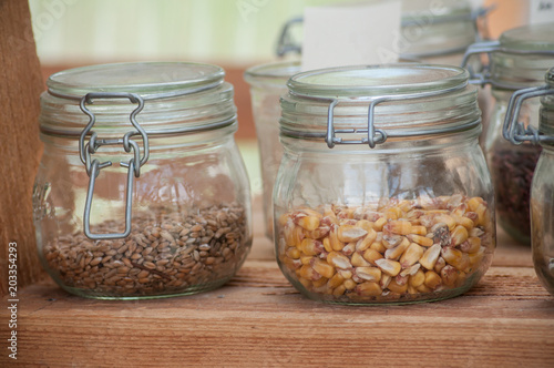  closeup of cereals seeds in glass containers