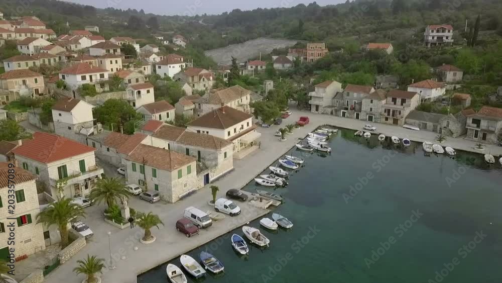 Aerial: Drone flying in front of city marina. Lots of ancient old traditional fishing houses. Filmed on sailing trip in Adriatic sea in Croatia. Aerial: Drone flying in front of city marina. Lots of ancient old traditional fishing houses. Filmed on sailing trip in Adriatic sea in Croatia.