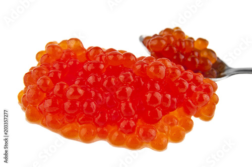 red caviar in a metal spoon isolated on a white background