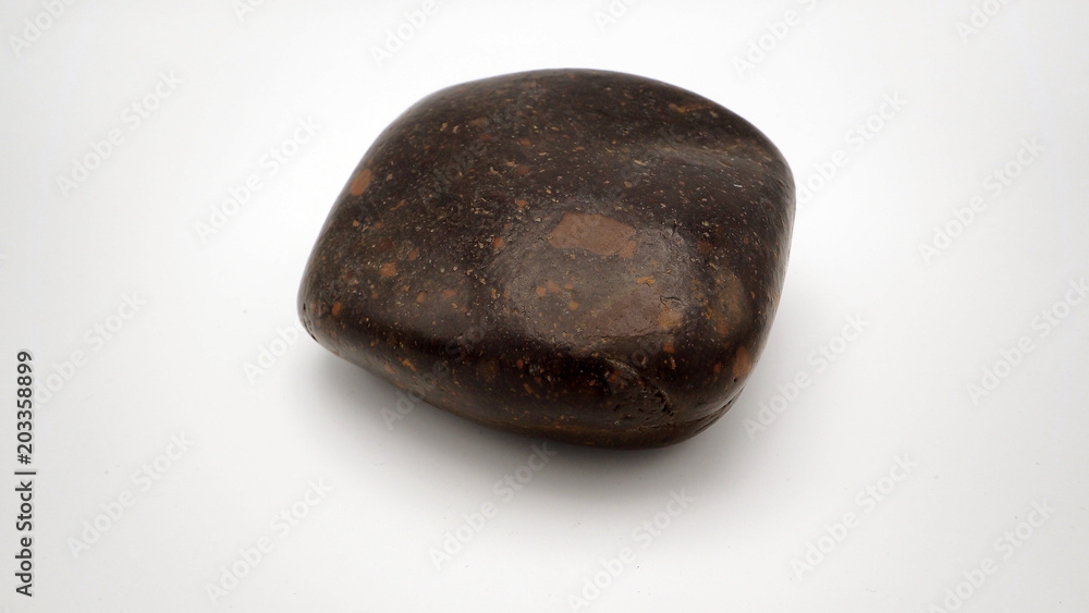one rock on white back ground one rock on white back ground