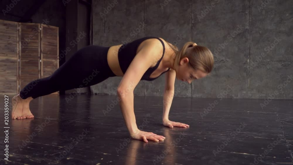 Fitness young woman doing push ups on exercise mat. Healthy young female working out at home. 4 k brunette woman at gym push up push-up workout exercise. Athletic Beautiful Woman Does Push-ups as Part Fitness young woman doing push ups on exercise mat. Healthy young female working out at home. 4 k brunette woman at gym push up push-up workout exercise. Athletic Beautiful Woman Does Push-ups as Part