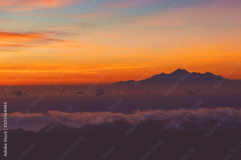 View of sunrise from the Mount Batur volcano, Bali, Indonesia.