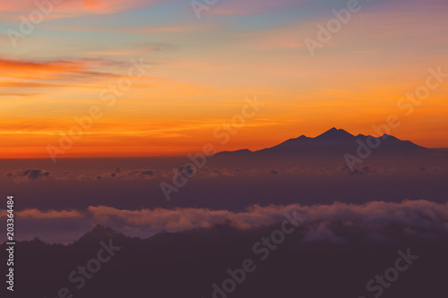 View of sunrise from the Mount Batur volcano, Bali, Indonesia. © astrosystem