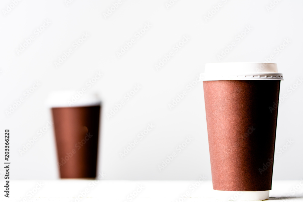 Takeout coffee cup on white. Brown paper cups isolated. Takeout coffee cup on white. Brown paper cups isolated.