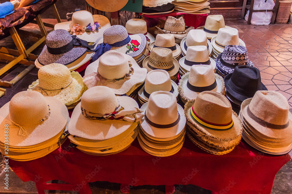 Various hats selling on the street night market in Bangkok
