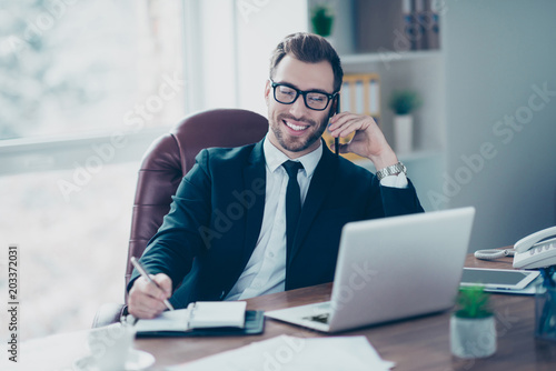 Listen notes people career person official concept. Cheerful polite friendly smart banker talking speaking with investors on mobilephone writing the date on meeting and conference to notebook