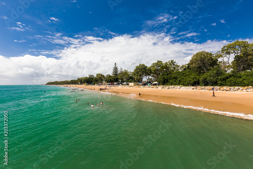 HERVEY BAY, AUS - APRIL 1 2018: People enjoying nice summer day on a beach in Hervey Bey, Australia photo