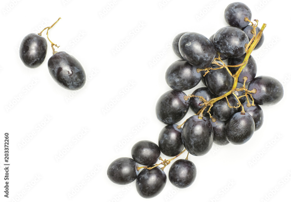 Black grape cluster (autumn royal variety) with two purple berries top view isolated on white background. Black grape cluster (autumn royal variety) with two purple berries top view isolated on white background.