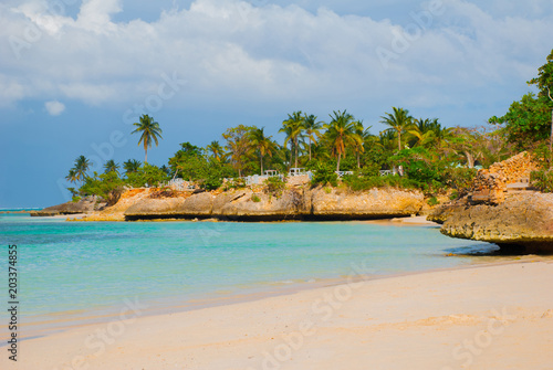 Holguin, Guardalavaca Beach, Cuba: Caribbean sea with beautiful blue-turquoise water and gentle sand and palm trees. Paradise landscape.