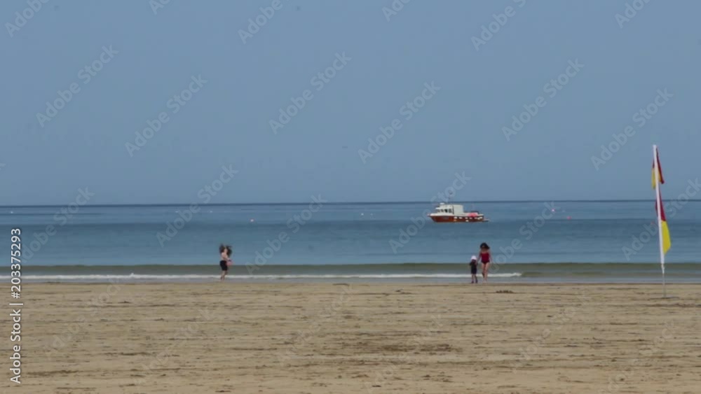 Children enjoying the delights of a Cornish beach at summertime Children enjoying the delights of a Cornish beach at summertime