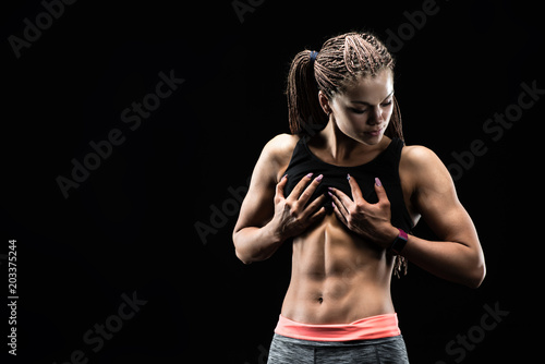 Sporty sexy girl with great abdominal muscles photo