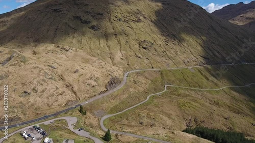 Aerial footage of the A83 road up to the Rest and Be Thankful car park and the Old Military Road through Glen Croe in West Central Scotland. photo