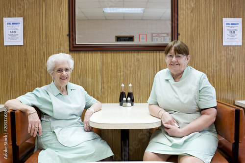 Portrait of two waitresses in diner