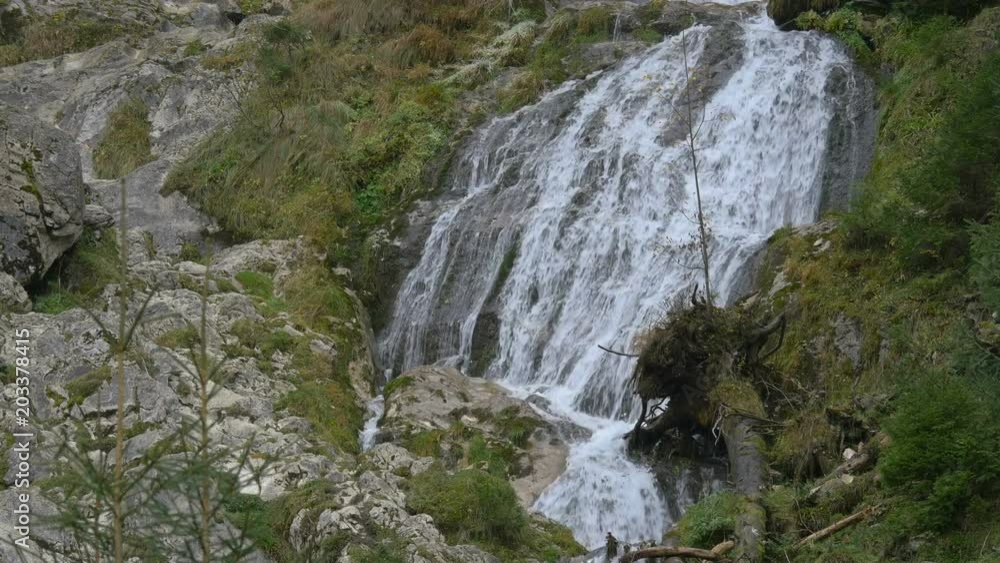 A mountain wall with a waterfall A mountain wall with a waterfall